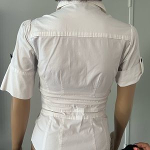 Bebe white dressy shirt with black buttons size S very chic…runs a bit small